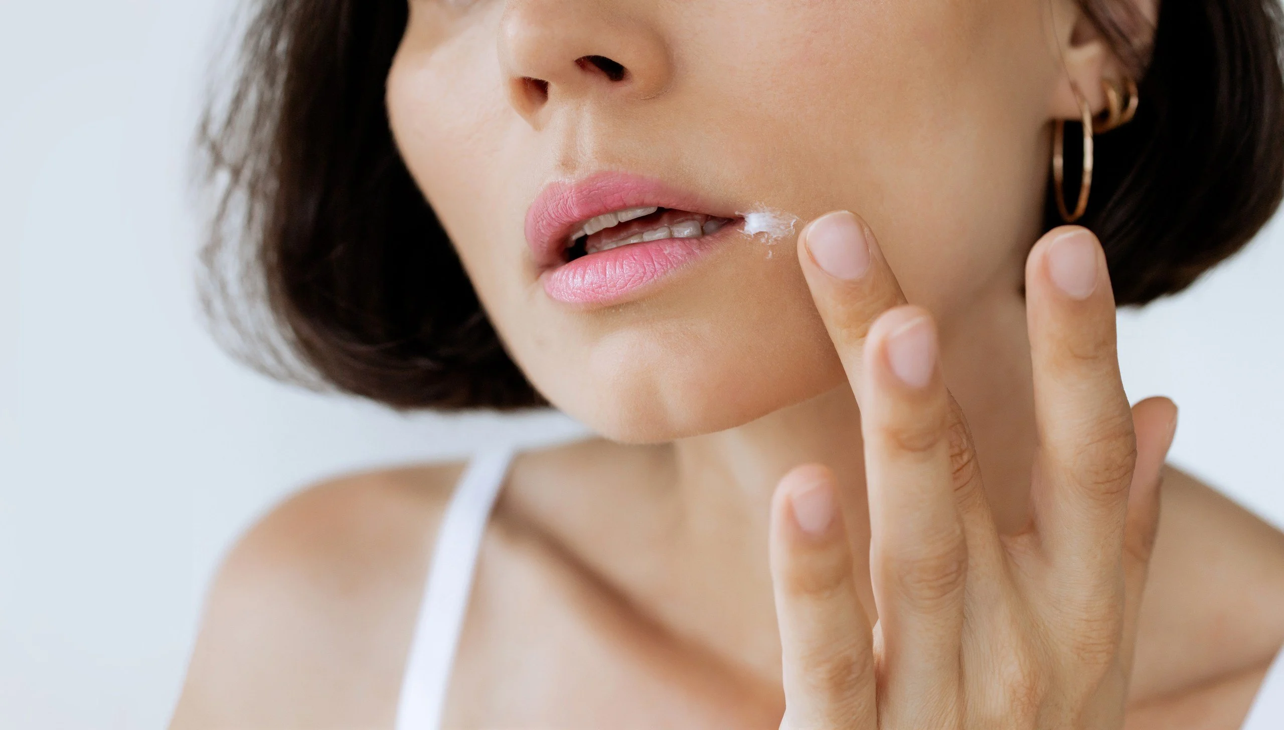 Close-Up of Woman Applying Ointment to Lips – Treatment for Dry Skin, Cracks or Cold Sores, Dermatological Skincare Concept